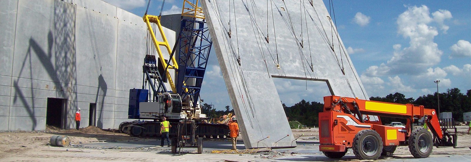 A Construction Site With a Crane and a Large Concrete Slab