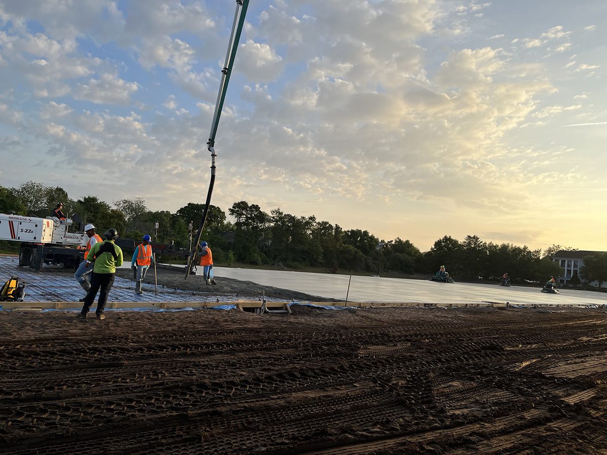 Construction workers on a dirt field